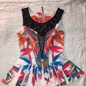 Multi-colored Peplum Mauve Top. Size small.